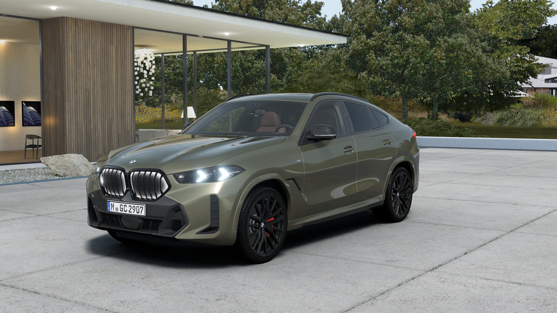 Olivgrüner BMW X6 vor einer Villa